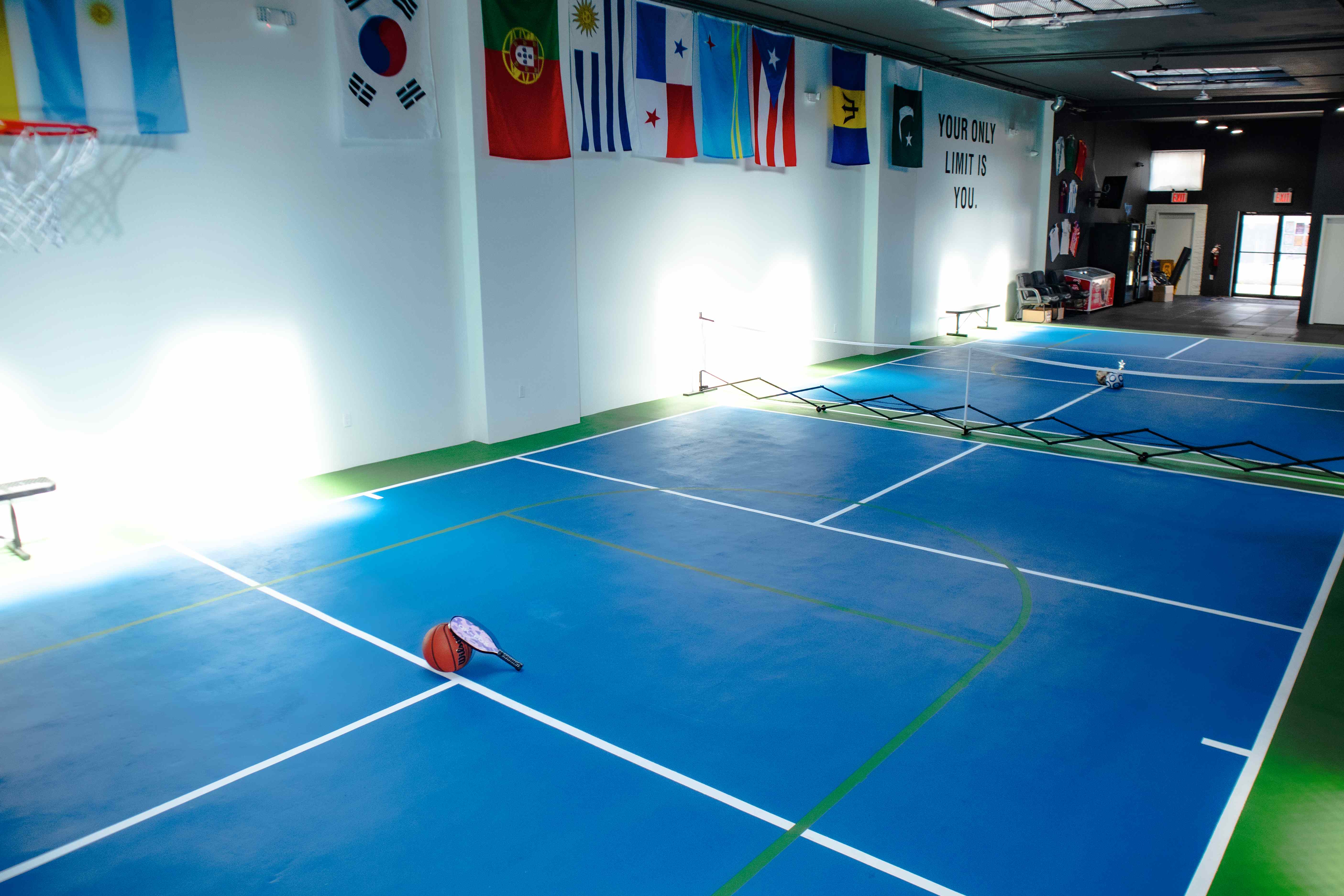 Angled view of the pickleball court with the 'Your Only Limit Is You' wall quote